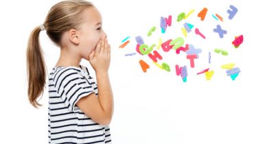 Cute little girl in stripped T-shirt shouting out alphabet letters. Speech therapy concept over white background.
